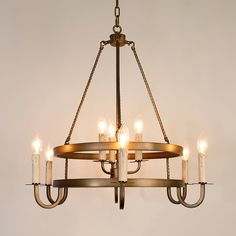 a chandelier with six lit candles hanging from it's center circle,