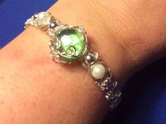 Excited to share this item from my #etsy shop: Silver Wire Woven Bracelet with Green Cabochon White Pearls Silver round Beads #greengembracelet #silverwovenbracelet #silvergreenbracelet Green Gem Bracelet, 9 Realms, Wire Clasp, Bunny Necklace, Woven Bracelet, Wire Work Jewelry, Diy Rings, Woven Bracelets, Wire Weaving