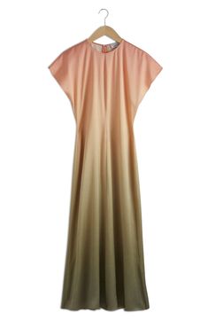 This mesmerizing maxi is designed in dreamy hues and framed by abbreviated dolman sleeves. Back zip closure Jewel neck Short sleeves 100% viscose Dry clean or machine wash, line dry Imported Minimalist Gown, Best Dresses For Women, Halterneck Mini Dress, Ombre Maxi Dress, Sheer Gown, Rose Print Dress, Velvet Midi Dress, Best Dresses, Strapless Midi Dress