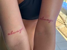 two women with tattoos on their arms that say, always and always in cursive writing