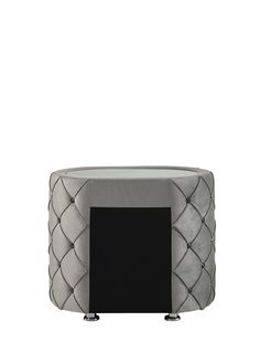 a grey and black ottoman sitting on top of a white floor