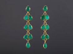 An exquisite piece of artwork, this pair of five-tier green onyx earrings would be nice reward for yourself or a great gift for your mother or best friend. Each one has five layers of green onyx stones set in leaflet shaped, gold vermeil bezels and laid in a dangling willow branch pattern. 1. Stones : green onyx  2. Stone shape and size: each stone is about 10 x 7 mm in pear shape the top layer has a stone framed with an ear post behind. 3. earring total length/width ~ 64 mm/15mm 4. bezel materi Green Onyx Jewelry With Matching Earrings, Elegant Green Linear Earrings As Gift, Elegant Green Dangle Linear Earrings, Elegant Handmade Green Linear Earrings, Green Emerald Dangle Chandelier Earrings, Green Gemstone Dangle Chandelier Earrings, Green May Birthstone Long Drop Jewelry, String Earrings, Earring Long