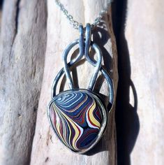 Very Colorful Corvette Fordite Pendant Necklace, Set In Sterling Silver. A 20 Inch Stainless Steel Chain Is Included. I Spend Hours Designing And Handcrafting Every Pendant. It's Very Rewarding For Me When I Start With Just Sterling Silver Sheet And Wire, And Make It Into A Unique And One Of A Kind Piece Of Jewelry. If You Would Like Additional Pictures, Please Let Me Know And I Will Take Some More. What Is Fordite? It's Overspray From Painting Cars, Trucks And Suv's At Assembly Plants As Well As Other Manufacturers Who Paint Car Parts. When The Paint Layers Build Up, It Eventually Gets Removed. From There I Purchase It And Then Cut, Shape And Polish Smaller Pieces To Be Used In My Jewelr Circle Designs, Unique Pendant Necklace, Full Circle, Circle Design, Car Painting, Steel Chain, Me When, Stainless Steel Chain, Car Parts