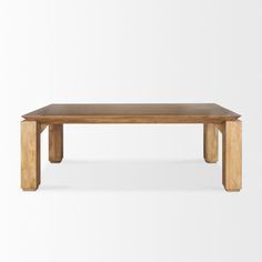 a wooden table sitting on top of a white floor