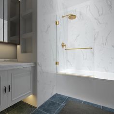 a bathroom with white marble and gold fixtures