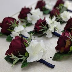 the flowers are arranged on the table ready to be put into the bouquets for the ceremony