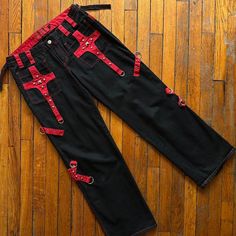 Vintage Y2k Tripp Nyc Wide Leg Pants Women Black Red Silver Metal Stud Goth Rave Streetwear Goth Punk Tripp Nyc Pants Perfect For Going Out Party Festival Rave Concert School College Halloween Costume Cosplay. Fitted Belt Looped Waistline With Zipper Fly And Metal Skull Button Close Front. Two Front Side Pockets With Two Zipper Back Butt Pockets. Zipper Adjustable Back Wide Legs. Multiple Accent Metal Clasps. In Excellent Condition. Size - Women - 11 #Vintagetrippnyc #Trippnycpants #Y2ktrippnyc Rave Streetwear, College Halloween Costume, Tripp Nyc Pants, Streetwear Goth, Rave Concert, Goth Rave, Wide Leg Pants Women, College Halloween, Metal Skull