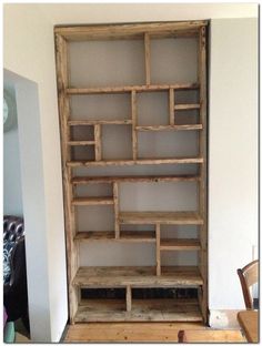 an old wooden bookcase in the corner of a room