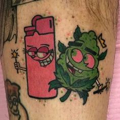 an image of a cartoon character tattoo on someone's leg that is pink and green