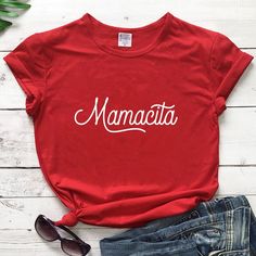 Ya gotta get your hands on this Mamacita Tee 'cause you know it's gonna add some serious sass to your outfit. Rock it with style, then show it off to your buddies - they're gonna want one, too! (But not as much as you want it!) Material: cotton Red Casual Shirt With Funny Text, Casual Red Shirt With Funny Text, Greater Is He, Jesus Funny, Boho Festival Fashion, 1 John 4, Cotton Outfit, John 4, Faith Bible