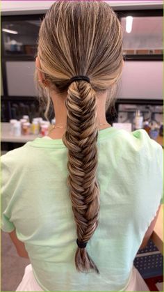 For a more intricate and unique look, try a fishtail braid. This braid looks complex but is surprisingly easy to create with a little practice. Start by dividing the hair into two sections. Take a small piece of hair from the outer edge of one section and cross it over to the other section. Repeat this process, alternating sides, until you reach the end of the hair. Secure the braid with a small hair tie and gently pull on the sides of the braid to loosen it for a more voluminous effect. The fis Fish Ponytail, Ponytail Fishtail Braid, Fish Tail Braids, Braid Looks, Fishtail Ponytail, Egyptian Hairstyles, Messy Fishtail Braids, Soccer Hairstyles, Volleyball Hair