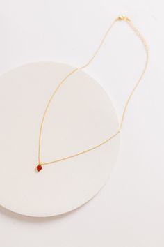 Delightful strawberry charm necklace 16" chain Approximate charm measurement - 1/4" Gold plated Jewelry Care: Lightly polish each jewelry piece with a soft cloth after wearing. Remove rings when washing hands. Do not shower or swim with your jewelry. Red Drop Jewelry For Gift, Red Drop-shaped Jewelry For Gift, Red Minimalist Jewelry With Birthstone, Minimalist Red Birthstone Jewelry, Small Red Jewelry Perfect For Gifting, Red Dainty Adjustable Necklace, Adjustable Red Dainty Necklace, Small Red Jewelry For Gift, Dainty Adjustable Red Necklace