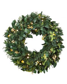 a christmas wreath with lights and greenery