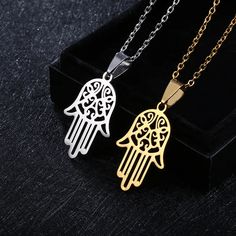 Introducing our Hamsa Hand Necklace – a symbol of protection and positive energy crafted with precision and style. This exquisite piece is made from durable stainless steel, ensuring longevity and a timeless appeal. Specifications: Material: Stainless Steel Size: 2cm wide x 3.1cm high (approximately 0.79 inches wide x 1.22 inches high) Chain Length: 20 inches Colors: Available in Silver and Gold The Hamsa Hand, a universal symbol of luck and protection, takes center stage in this finely crafted Evil Eye Choker, Hamsa Hand Necklace, Hand Pendant, Hand Necklace, Gold Hands, Stainless Steel Pendant, Hamsa Hand, Stainless Steel Necklace, Stainless Steel Chain