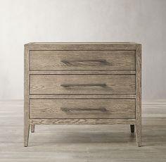 a wooden dresser with three drawers on one side and an open drawer on the other