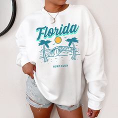 Florida Sweatshirt Preppy Sweatshirt Clearwater Crewneck Beach Sweatshirt Trendy Crewneck Aesthetic Crewneck Moving To Florida Hoodies Ideal for any situation, a unisex heavy blend crewneck sweatshirt is pure comfort. These garments are made from polyester and cotton. This combination helps designs come out looking fresh and beautiful. The collar is ribbed knit, so it retains its shape even after washing. There are no itchy side seams on these sweaters. .: 50% Cotton 50% Polyester .: Medium-heav Florida Hoodie, Florida Sweatshirt, Crewneck Aesthetic, Sweatshirt Preppy, Aesthetic Crewneck, Preppy Sweatshirts, California Sweatshirt, Trendy Crewneck, Beach Sweatshirt