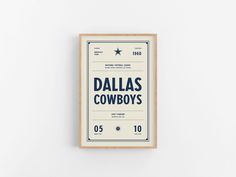 the poster for the movie dallas cowboys is displayed on a white wall in an empty room