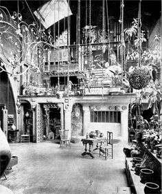 an old black and white photo of a living room filled with lots of furniture in it