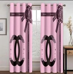 pink curtains with black and white designs on them