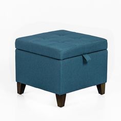 a blue ottoman sitting on top of a white floor