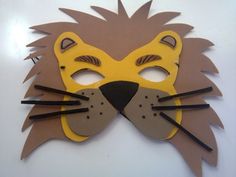 a paper mask with a lion's face on it