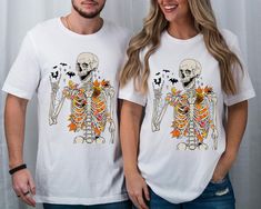 Delano The Fall Shirt, Skeleton Tshirt For Men, Halloween Shirt Gift, Trendy Tshirt, Cute Halloween Shirt Gift, Funny Fall Couples Tshirt  Welcome to our store where there are special stylish and comfortable t-shirts for everyone. This is the address to make yourself and your loved ones happy. We wish you pleasant shopping. ❀DETAIL❀ We use Bella Canvas and Gildan SoftStyle brand shirts for printing. *Bella Canvas -unisex size -4.2 oz. -Solid colors are 100% Combed Cotton and Ring-Spinned Cotton. -Athletic Heather 90% Combed and Ring-spun Cotton, 10% Polyester -All Heather CVC Colors 52% Combed and Ring-Spinned, 48% Polyester *Gildan SoftStyle -unisex size -Sport Gray : 4.5 oz/yd² | 90% Ring Cotton / 10% Polyester -Heather Navy, Heather Burgundy, Heather Galapagos Blue, Dark Heather : 4.5 o Halloween White Shirt With Skull Print, White Skull Print T-shirt For Fall, White T-shirt With Skull Print For Fall, Halloween White Skull Top, White Skull Print T-shirt For Halloween, Skeleton Tshirt, Fall Couples, Funny Fall, Men Halloween