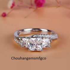 three stone engagement ring with side stones