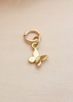 This gold filled butterfly charm is a stunning addition to any charm bracelet or necklace. Made with high-quality 14k gold vermeil, it makes for a thoughtful gift for Mother's Day. The intricate design of the butterfly is a perfect representation of love and transformation. Add this unique charm to your collection today. Dimensions: 14.6 x 8.6mm Butterfly Charm Dangle Jewelry As Gift, Adjustable Rose Gold Jewelry With Butterfly Charm, Rose Gold Adjustable Jewelry With Butterfly Charm, Gold Huggie Earrings With Butterfly Charm, Adjustable Butterfly Gold Jewelry, Adjustable Butterfly Charm Jewelry For Everyday, Adjustable Gold Butterfly Jewelry, Adjustable Everyday Jewelry With Butterfly Charm, Adjustable Butterfly Shaped Yellow Gold Jewelry