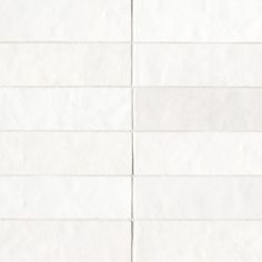 a white tiled wall with lines drawn on the bottom and one line in the middle