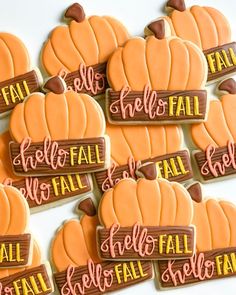 several decorated cookies with the words fall and pumpkins