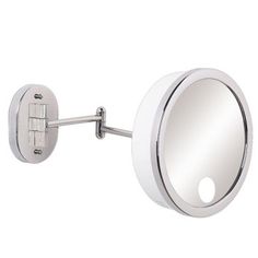 a bathroom mirror mounted to the wall with a magnifying glass on it's side