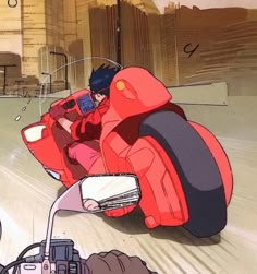 a man riding on the back of a red motorcycle