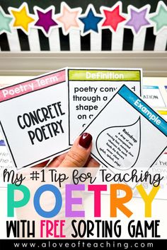 a person holding up two posters with the words poetry on them and stars in the background