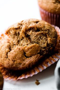 two muffins sitting next to each other on top of a white countertop