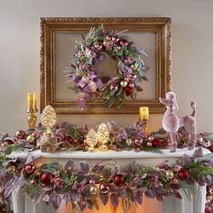 a mantel decorated with christmas decorations and wreaths