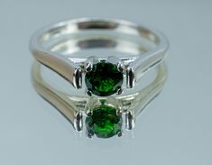 This is a beautiful Green Chrome Diopside from Russia set in Sterling Silver. This amazing stone has the perfect vibrant green color that comes with the best Chrome Diopside that rivals expensive Tsavorite Garnets along with a fantastic cut, and good clarity! Chrome Diopside is one of the more rare stones on earth and is known for having some of the best green colors without any treatments, you will not be disappointed in this gorgeous piece! This perfect sized 4.5mm round Chrome Diopside weighs Best Green Colors, Green Heart-cut Jewelry With Prong Setting, Green Sterling Silver Gemstones With Polished Finish, Green Sapphire Ring Sterling Silver, May Birthstone, Green Polished Sterling Silver Gemstones, Chrome Diopside Ring, Green Chrome, Tsavorite Garnet, Rare Stone