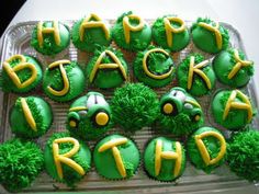 cupcakes with green frosting and yellow decorations