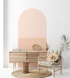 a living room with a chair, table and potted plant