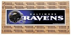 the baltimore ravens wooden sign is made out of wood and has holes in it to hold football helmets