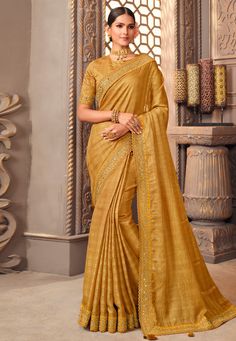 Organza Saree with blouse in Golden colour 1209A Desc: Color : Golden Fabric : Organza Work : Embroidery Wash Care : Dry clean Sleeve Style : Half Sleeve Long Sleeves : Done only in Custom Stitch Sleeves Lining : Done only in Custom Stitch Bust Size : 32 to 42 Inches Occasion : Temple Wear Social Gathering Pongal Gudi Padwa Onam Ugadi. With Express Free Shipping Buy Indian Party wedding wear Bridal Sarees Organza Saree with blouse in Golden colour 1209A online in USA, UK and Canada from KollyBol Elegant Slub Silk Blouse For Navratri, Yellow Blouse With Zari Work For Eid, Yellow Blouse With Zari Weaving For Navratri, Yellow Festive Top For Eid, Eid Slub Silk Blouse With Traditional Drape, Semi-stitched Yellow Blouse For Eid, Festive Yellow Blouse With Zari Weaving, Festive Slub Silk Blouse With Self Design, Semi-stitched Slub Silk Blouse With Pallu