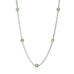 A high-impact look with shimmer to spare, this stunning necklace pairs sterling silver rolo-link chain with dazzling peridot gemstones in a look that grabs the eye. Five gorgeous 3.0mm round peridots are carefully bezel set along the chain, creating the illusion that they are floating in midair. Polished to a brilliant shine, this 18.0-inch necklace makes a thoughtful gift for the August birthday girl. The style secures with a lobster claw clasp. Sterling Silver Cable Chain Jewelry For May Birthstone, August Birthday, Peridot Stone, Peridot Gemstone, Station Necklace, Stunning Necklace, Birthday Girl, White Metal, Stone Settings