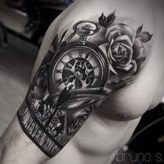 a man with a clock and roses tattoo on his arm