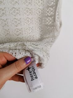 Beautiful off-white sheer crochet knit crop top, fringed hem/ Excellent vintage condition. Would fit size XS. Model wears size 8-10 UK, S-M US, is 160 cm tall and weighs 54 kg. All of our items are freshly laundered with quality detergents and fabric softeners, absolutely ready to wear the moment you receive them! Keep in mind, this item is vintage and subtle signs of passing time may be present, adding to its character and making it even more worthy of your love. For more info, additional photo White Open Knit Lace Top, White Lace Top With Open Knit Detail, White Cropped Crochet Top With Lace Trim, Stretch Lace Crochet Top With Open Knit, Lace Crochet Top With Open Knit Stretch, White Cropped Lace Crochet Top, Stretch Lace Crochet Top, Stretch Lace Crochet Top With Crochet Trim, White Lace Crochet Crop Top