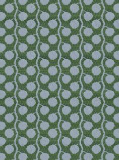 a green and blue fabric with white circles on the top, as well as dots in the middle