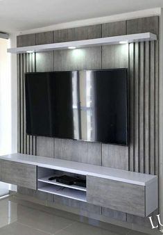 a large tv mounted on the side of a wall