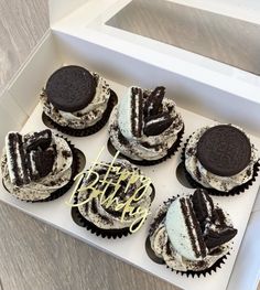 six oreo cookies in a white box with the word happy birthday written on them