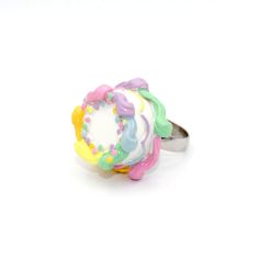 "Details: - adjustable ring (best fits size 6 and up) -beautifully detailed pastel rainbow birthday cake -round cake frosted with vanilla buttercream and piped rainbow buttercream edges & lacy frosting decoration around the middle and topped with classic rainbow confetti sprinkles. -Glossy finish, durable -cake is 1.20\" wide by 1/2\" tall Matching Necklace and earrings in my shop>> http://fatallyfeminine.etsy.com **Made to order**May take up to 2 weeks to make before shipment. Each on Rainbow Novelty Jewelry For Birthday, Handmade Pastel Jewelry For Birthday, Playful Multicolor Rings Perfect For Gifts, Playful Multicolor Rings For Gifts, Cute Multicolor Round Rings, Fun Pastel Jewelry For Gifts, Fun Pastel Colored Jewelry For Gifts, Cute Multicolor Rings For Gift, Cute Multicolor Rings For Gifts