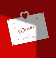 a paper with the word beaustice on it and a heart cut out from it