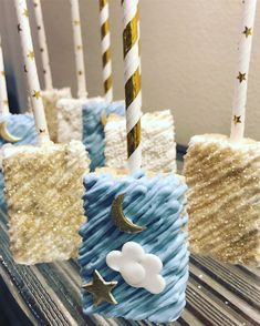 there are some candles that have been made to look like clouds and stars on them