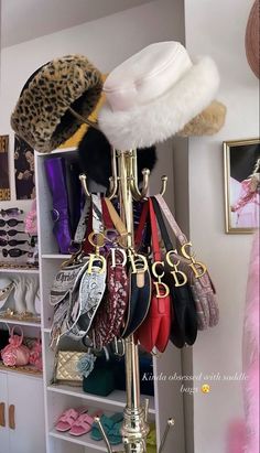 a rack with hats and purses on it in a room filled with other items